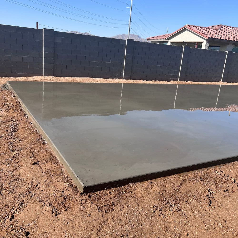 A concrete slab in a backyard poured by the concrete contractor, Ohana's Concrete Specialist